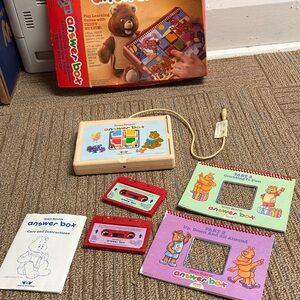 Teddy Ruxpin answer box with two tapes and two books.